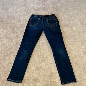 Dark wash Silver Jeans.